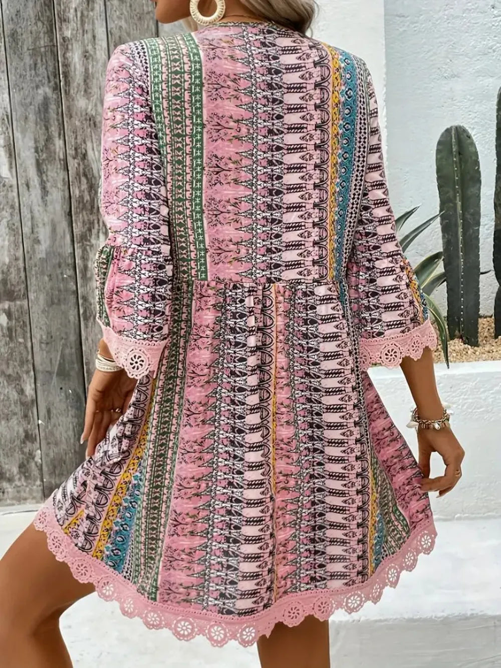 Boho printed mini dress with lace trim and bell sleeves