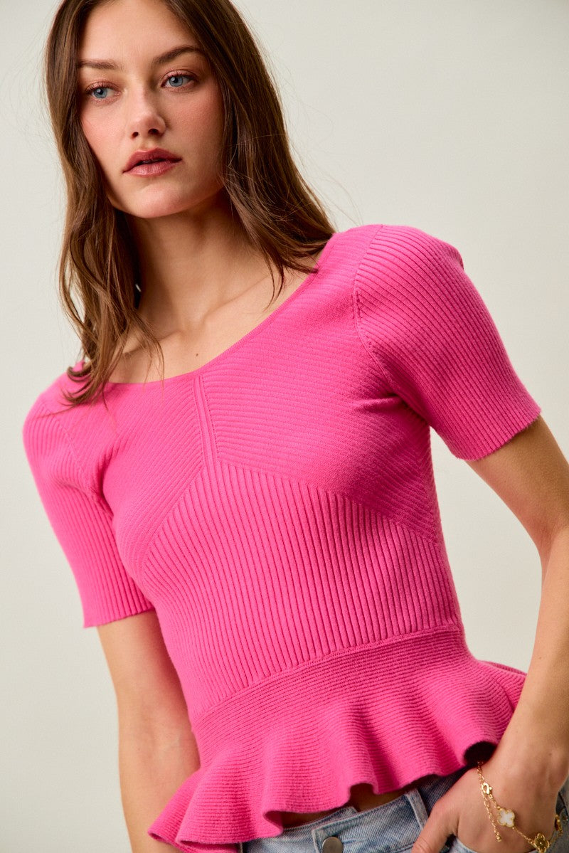 Ribbed knit peplum top with short sleeves and scoop neck