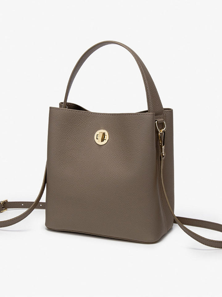 Pebbled faux leather bucket crossbody bag with twist lock