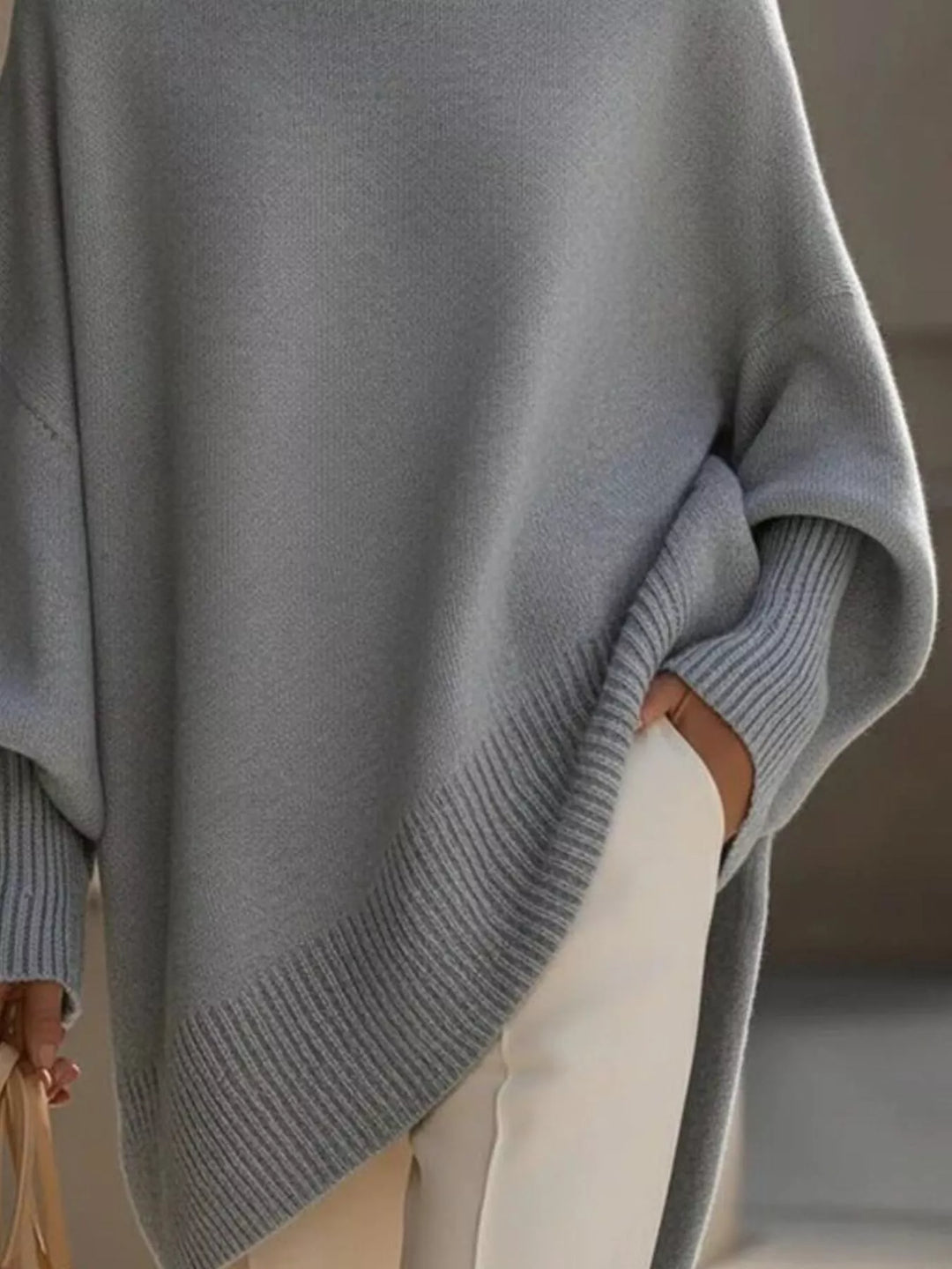 Batwing sleeve oversized sweater with asymmetric hem