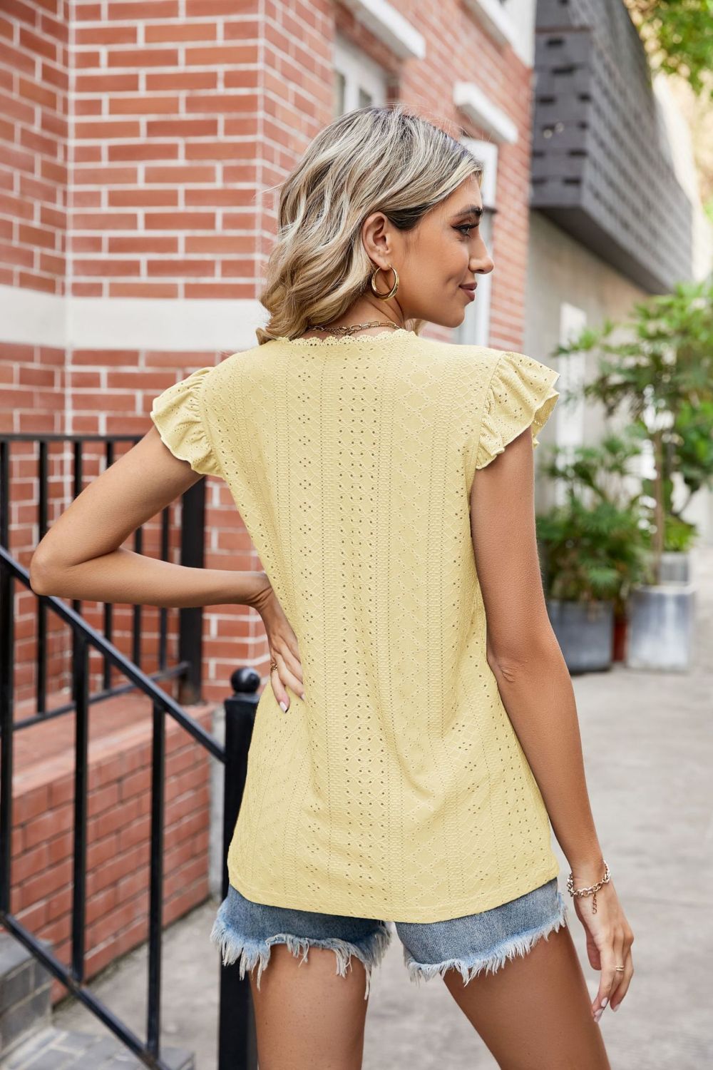 Eyelet flutter sleeve top with scalloped V-neck