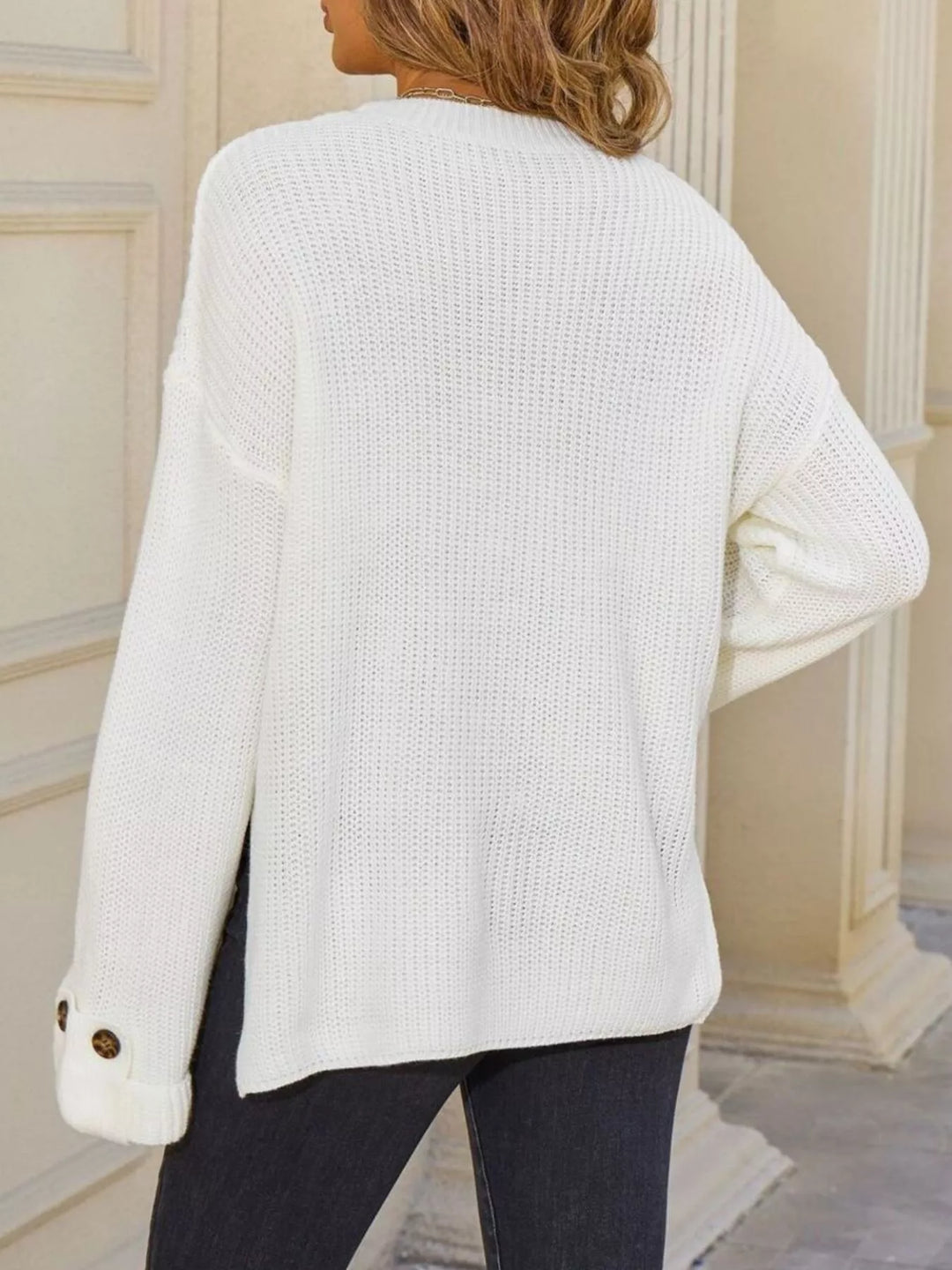 Ribbed knit sweater with chest pockets and button cuffs