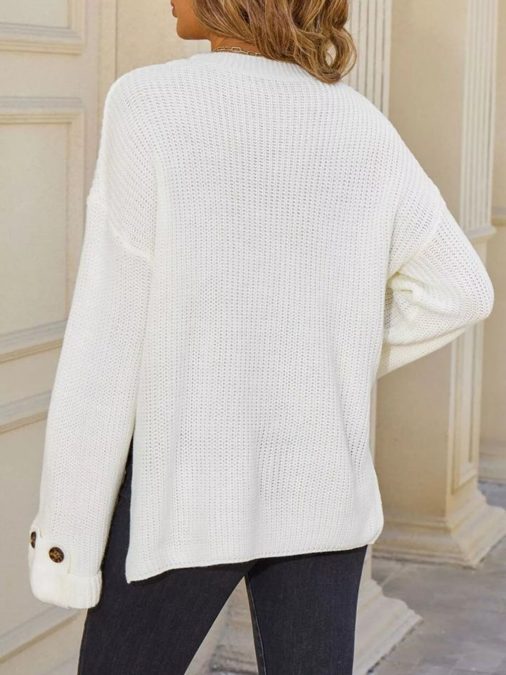 Ribbed knit sweater with chest pockets and button cuffs