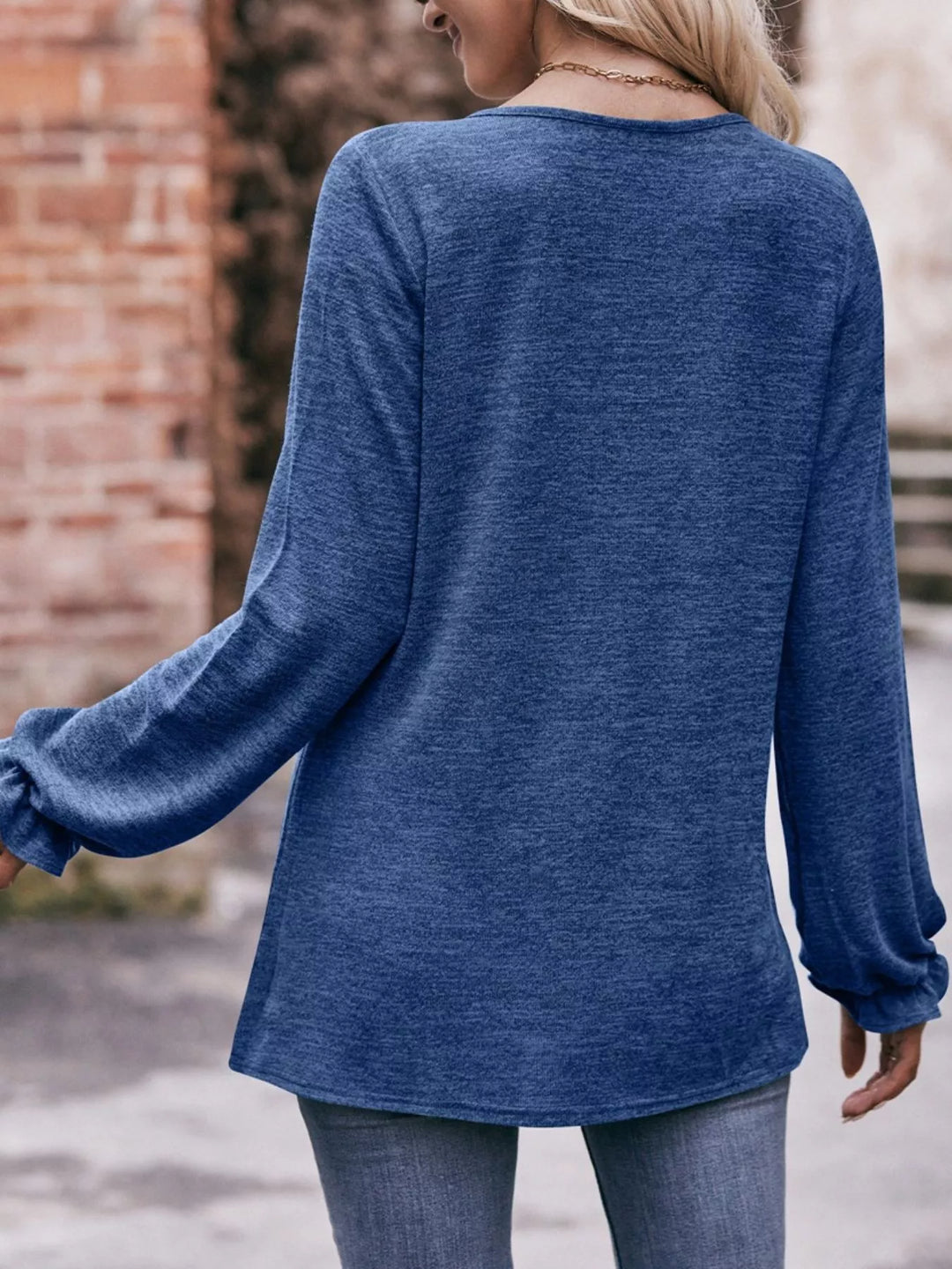 Ruffle cuff long sleeve top with pleated neckline