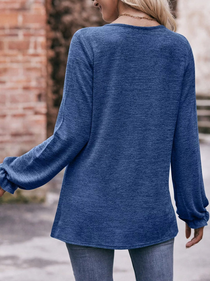 Ruffle cuff long sleeve top with pleated neckline