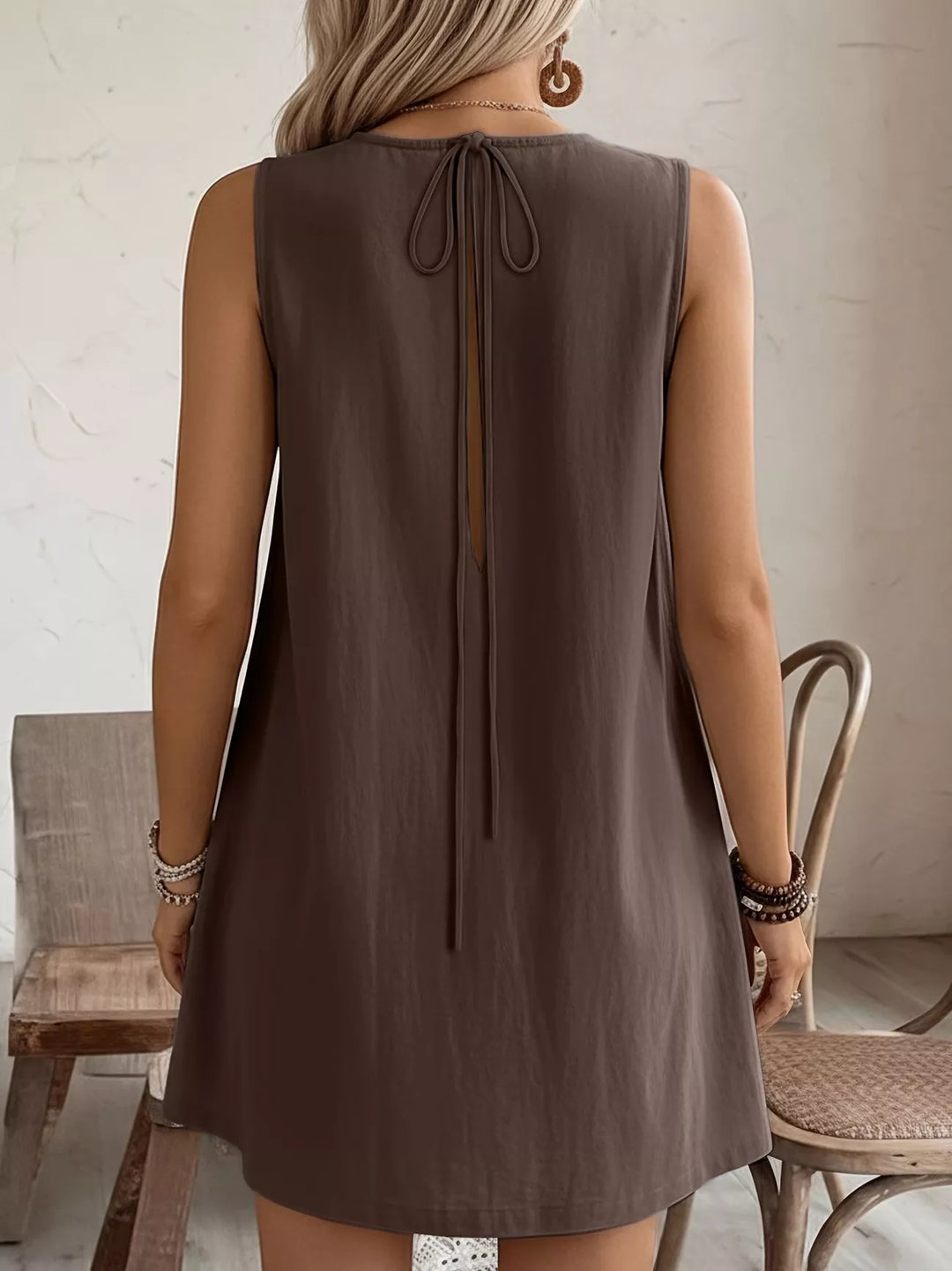 Ruffle-trim sleeveless mini dress with side pockets