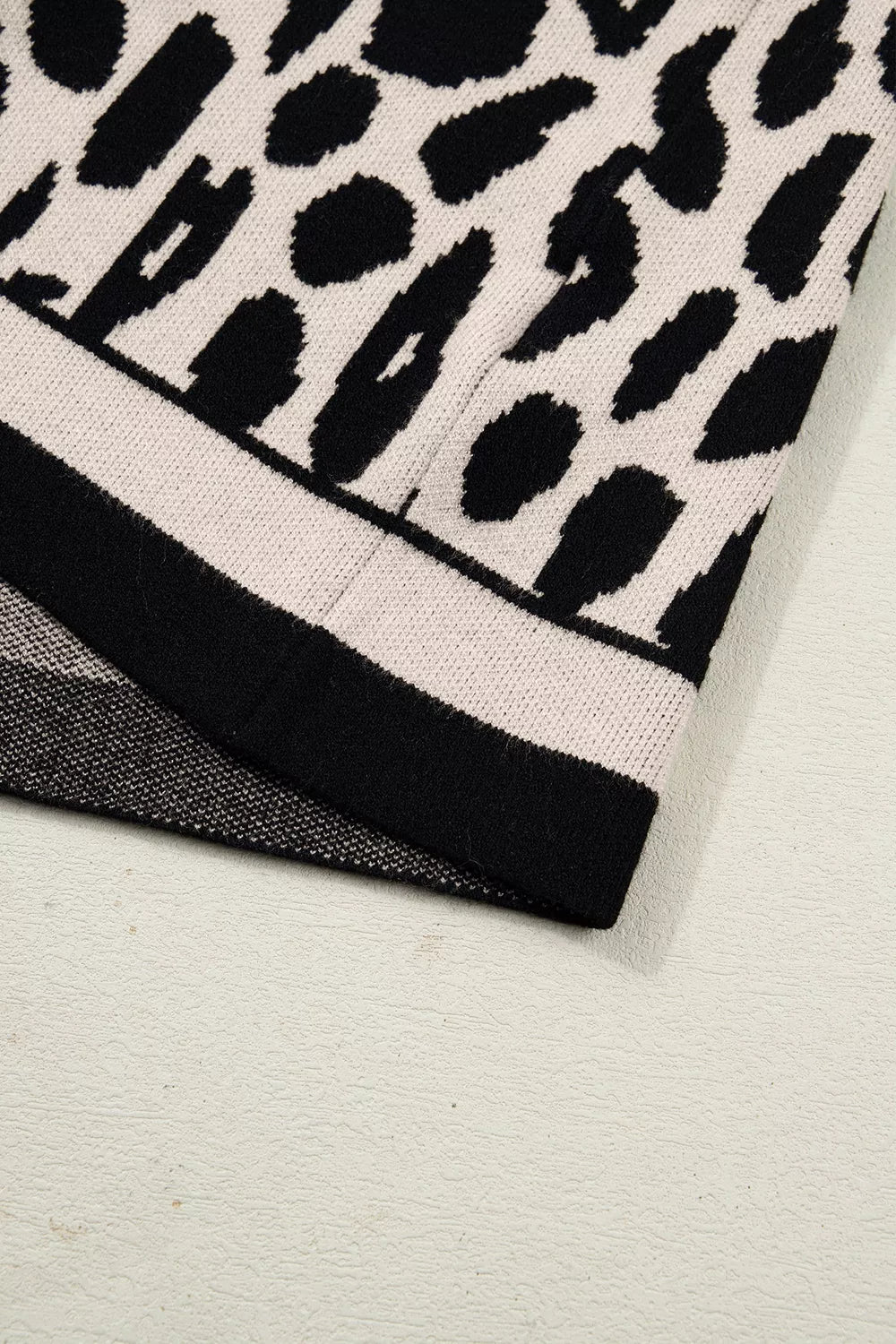 Leopard print mock neck cap sleeve sweater top