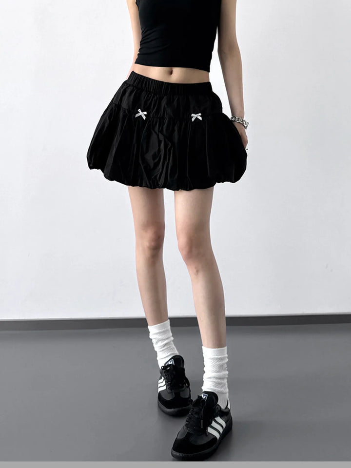 Bubble hem mini skirt with bow trim and elastic waist
