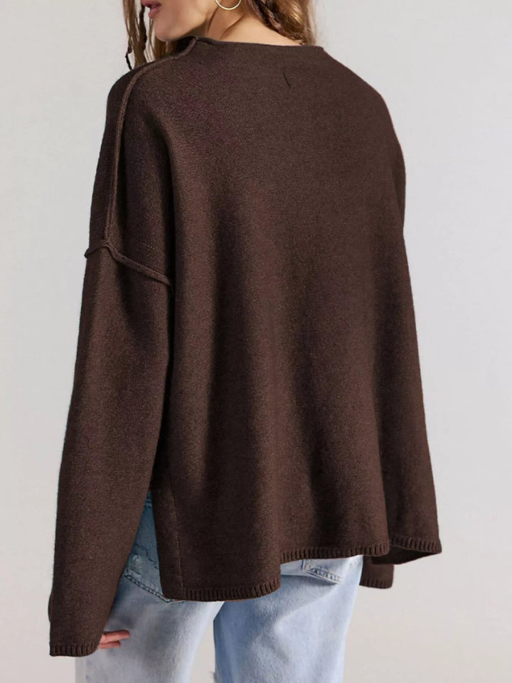 Exposed seam oversized knit sweater with wide sleeves
