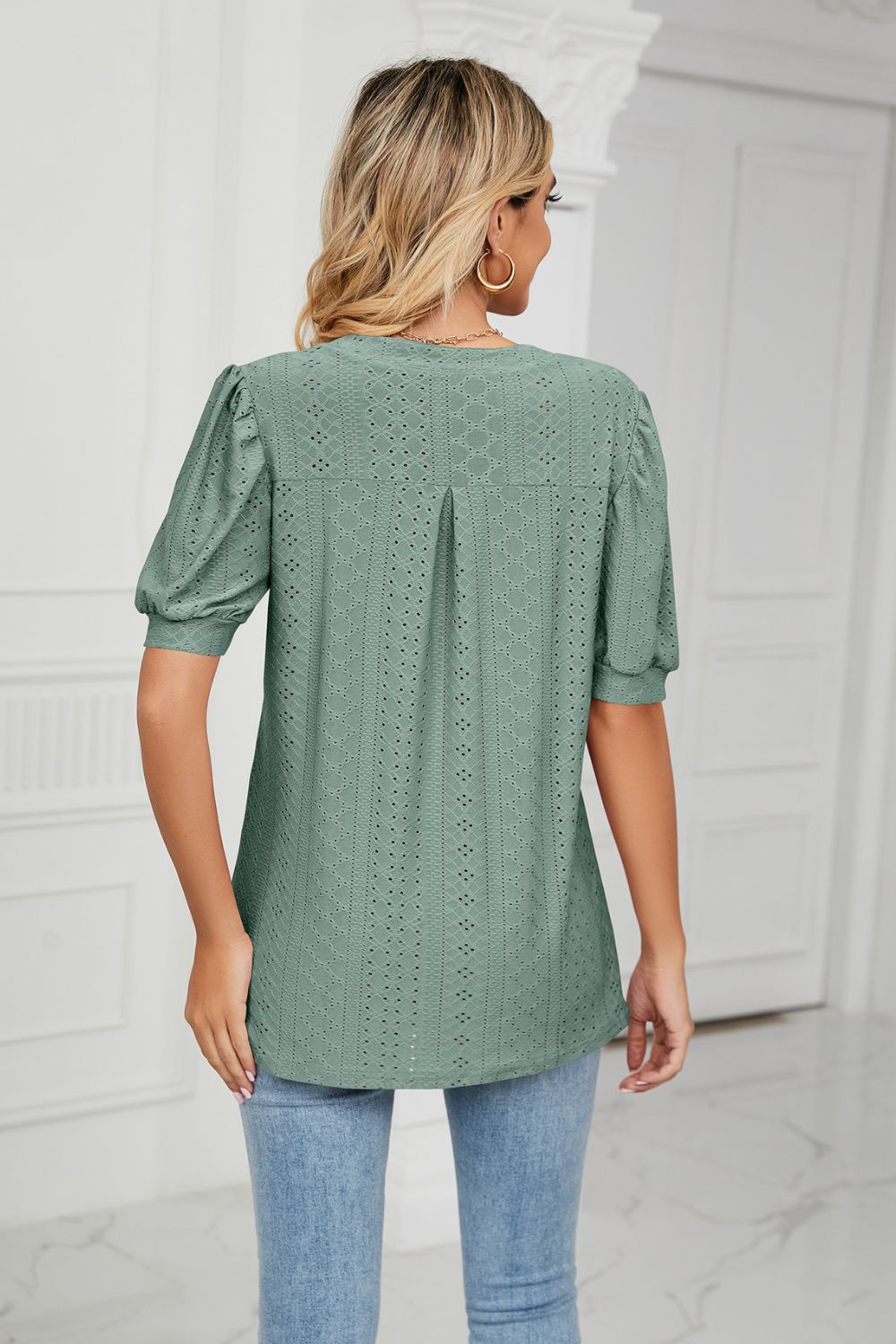 Eyelet puff sleeve top with notched V-neck