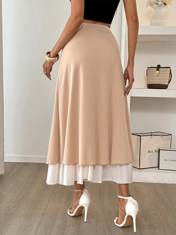 Layered A-line midi skirt with contrast ruffle hem