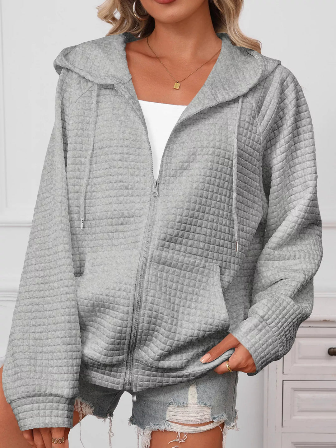 Textured quilted zip-up hooded jacket with pockets