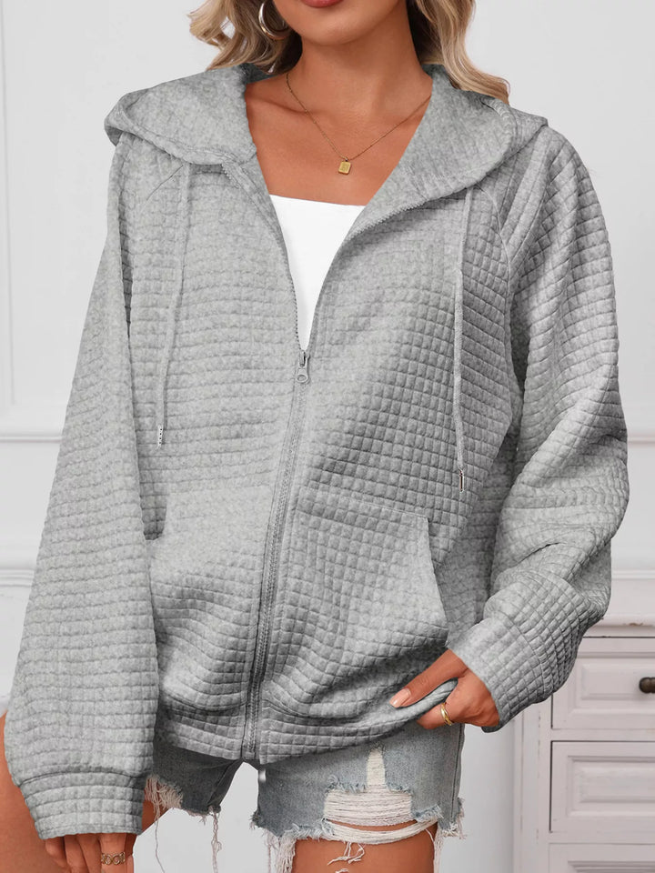 Textured quilted zip-up hooded jacket with pockets