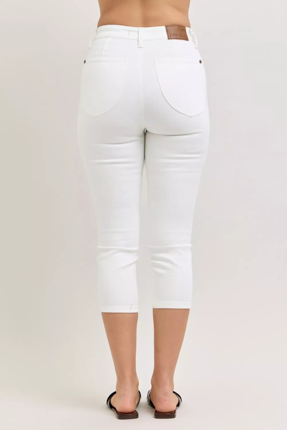 High-rise slim capri jeans with spade back pockets