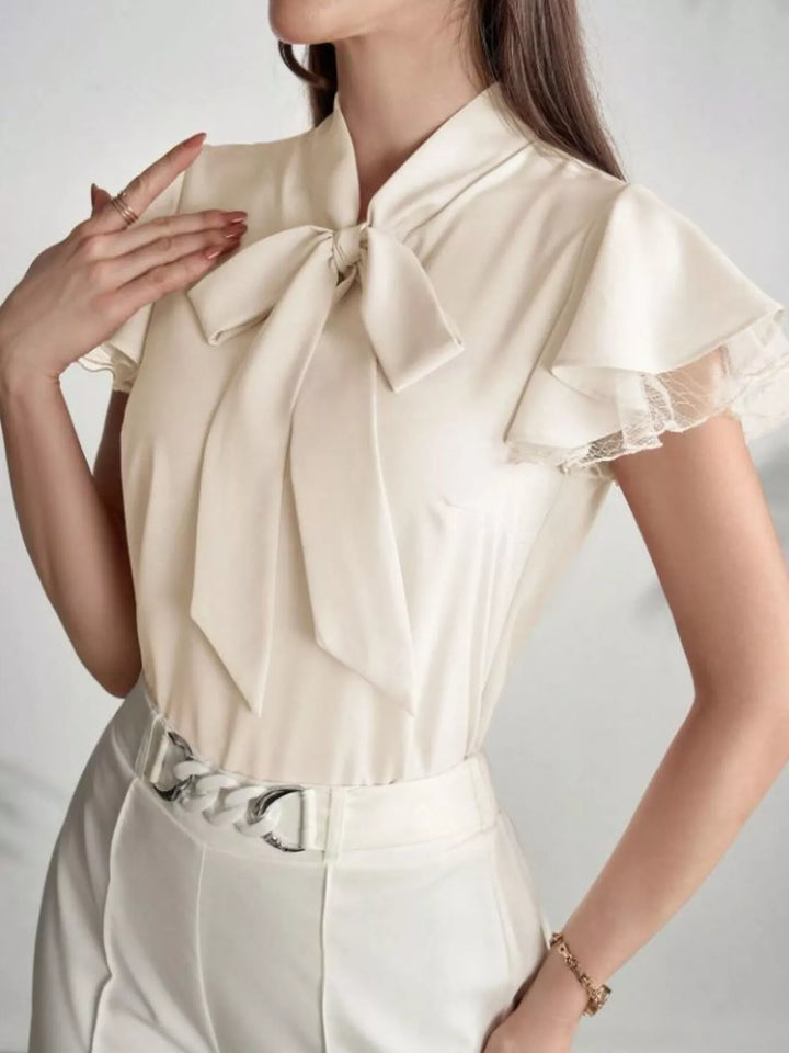Beige Tie-neck ruffle cap sleeve blouse with lace trim