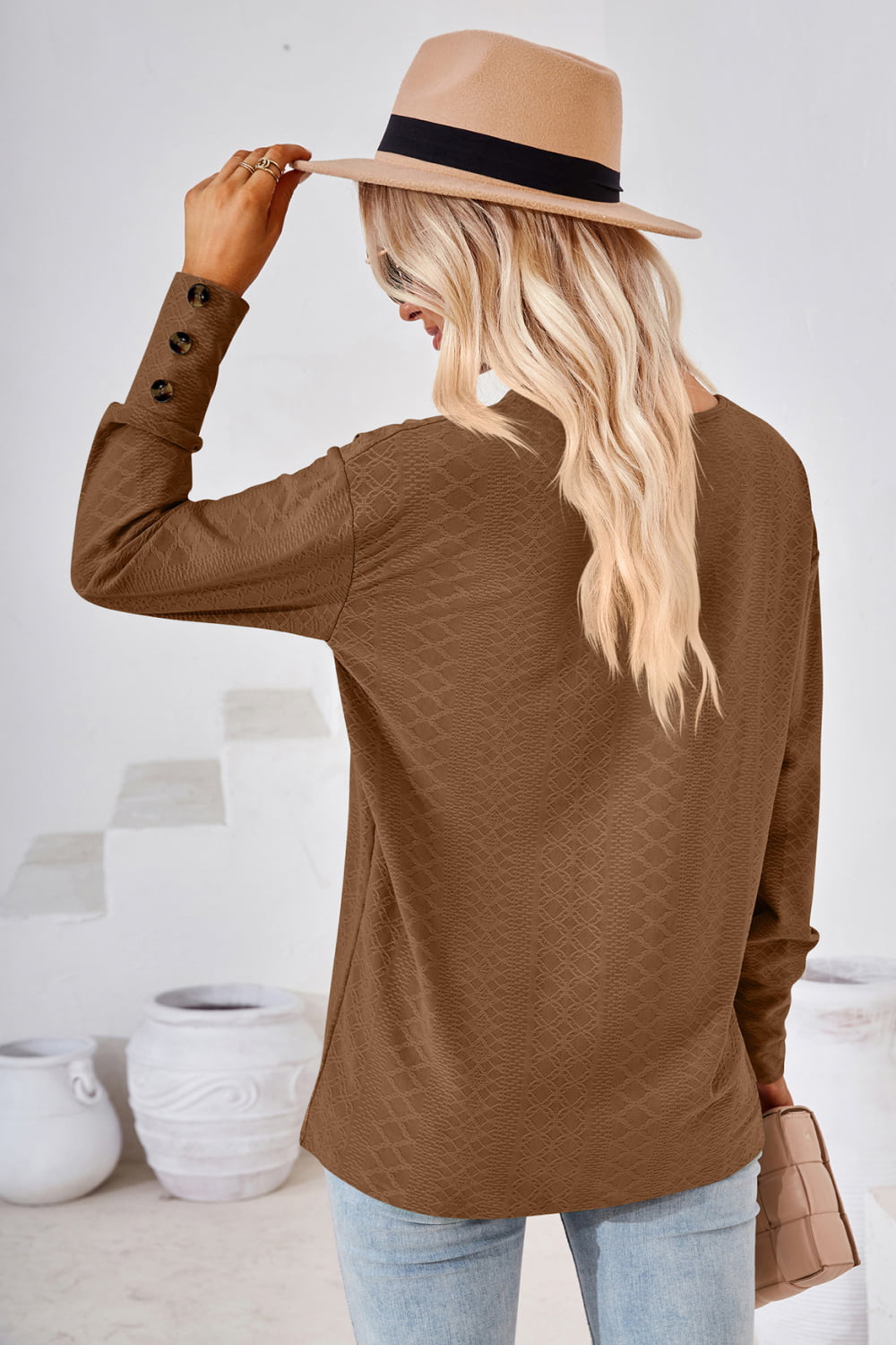 Textured knit V-neck long sleeve top with button cuffs