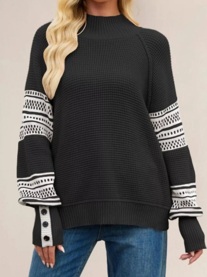 Waffle knit mock neck sweater with geometric sleeve stripes