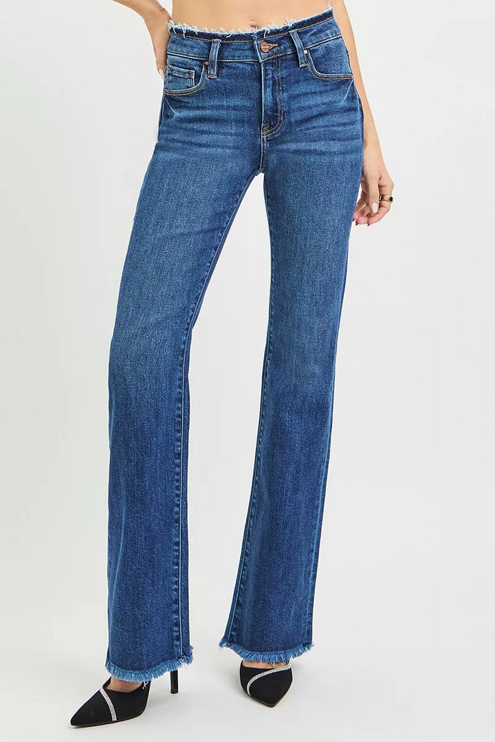 Mid-rise bootcut jeans with frayed waistband and raw hem