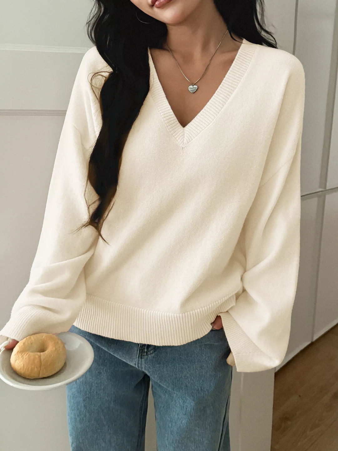 V-neck loose knit sweater with ribbed trim
