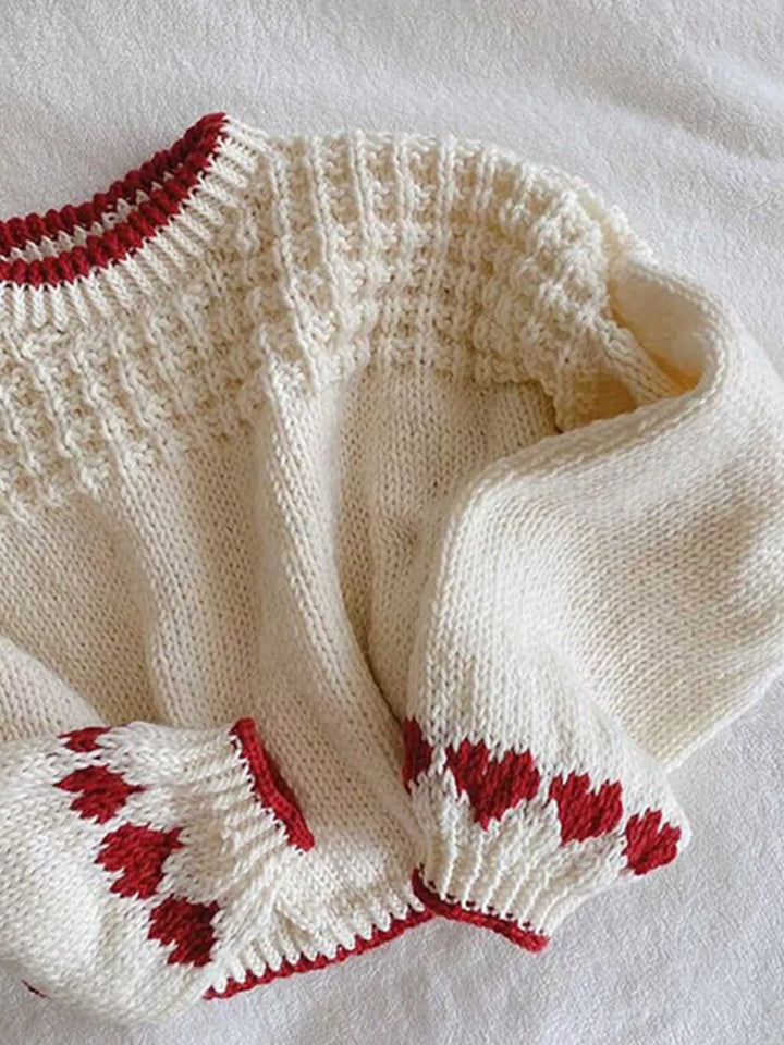 Chunky knit sweater with heart cuffs and contrast trim
