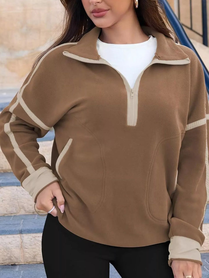 Half-zip fleece pullover with contrast trim and zip pockets
