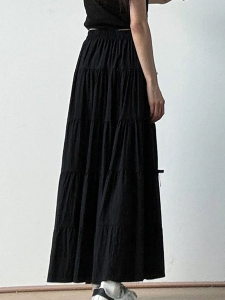 Tiered bow-accent maxi skirt with elastic smocked waist
