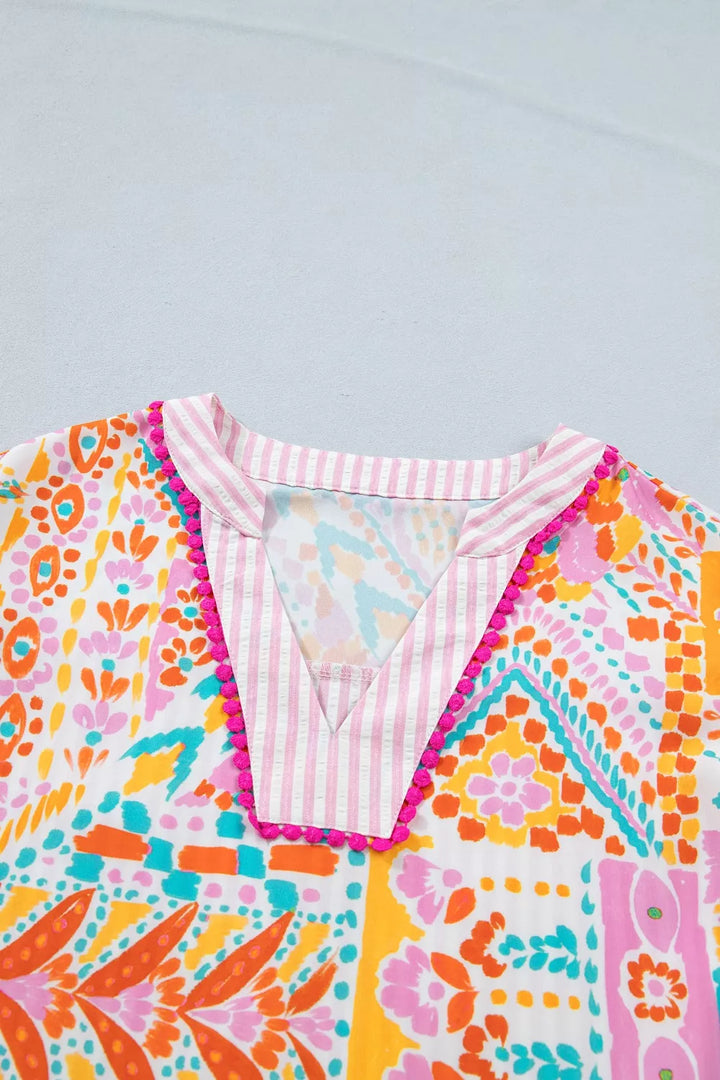 Patchwork mixed print blouse with ruffle sleeves and pom-pom trim