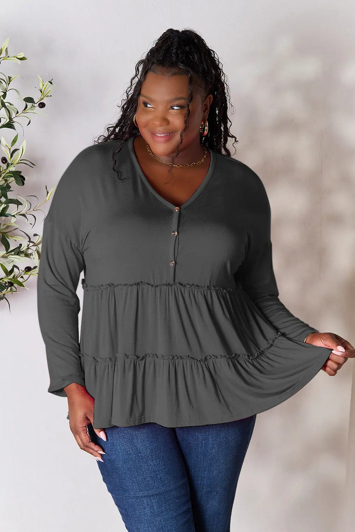 Half-button long sleeve blouse with tiered ruffle hem