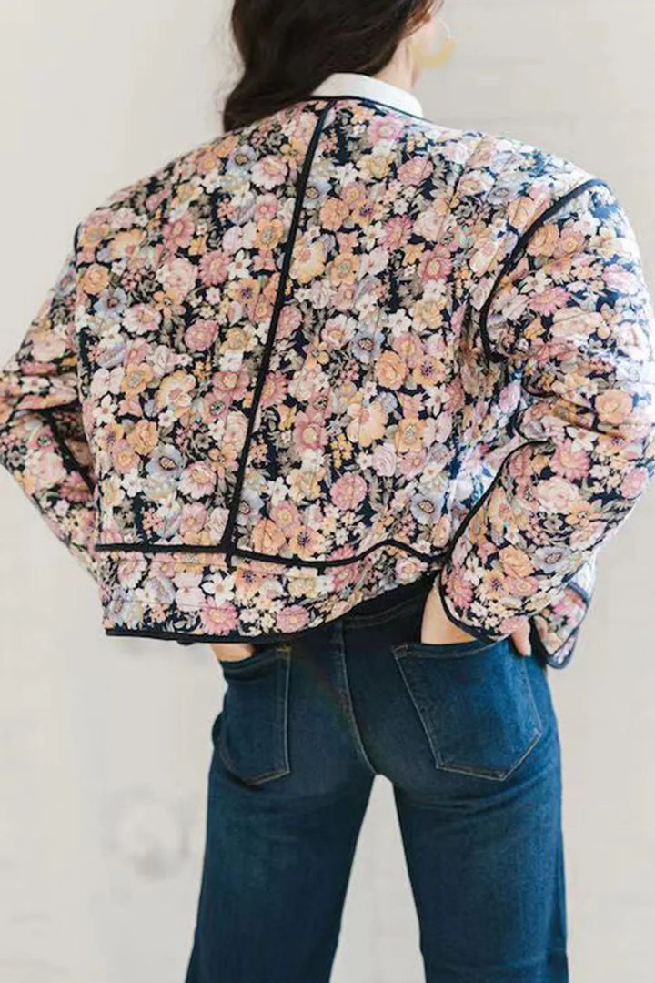 Quilted floral jacket with contrast piped trim and round neck
