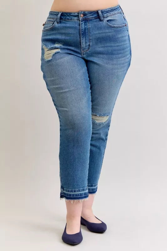 Distressed mid-rise boyfriend jeans with released raw hem