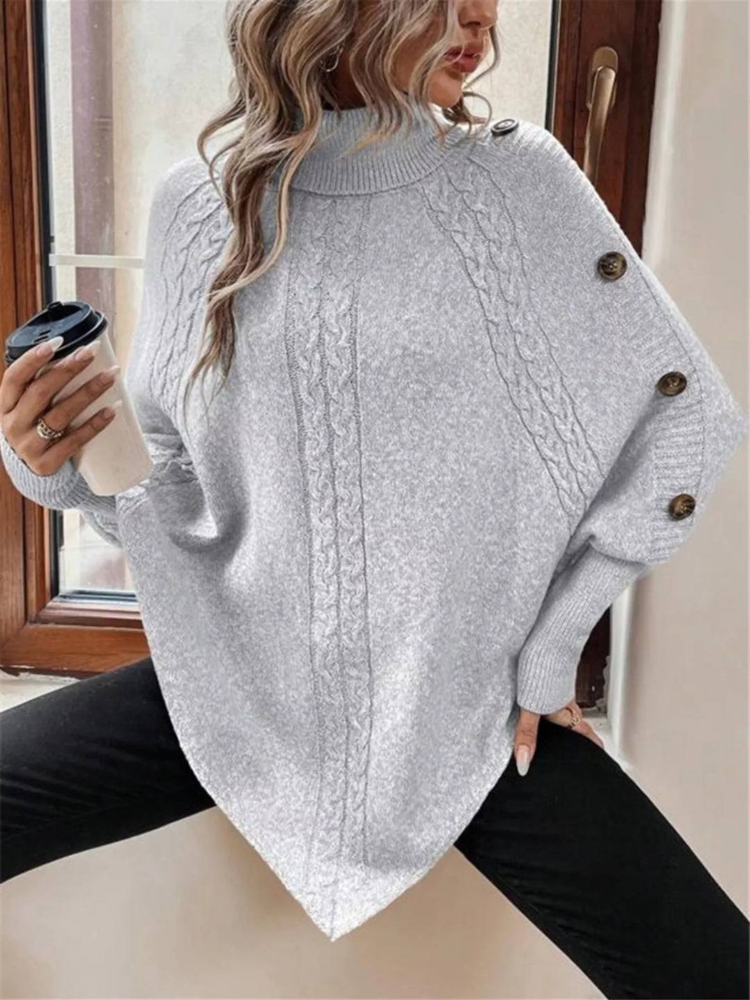 Cable knit turtleneck cape sweater with button shoulder