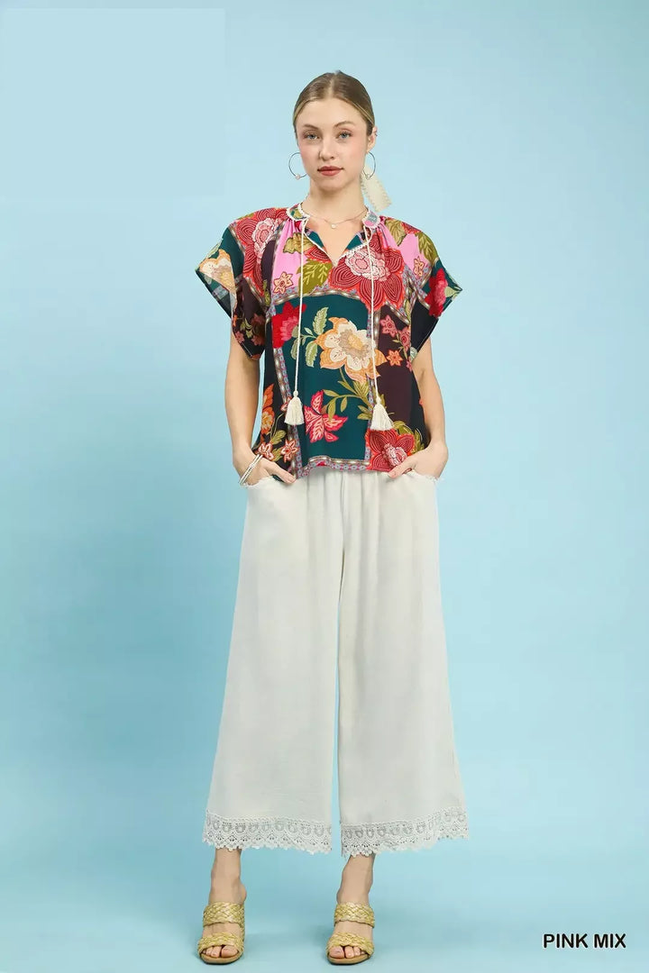 Mixed floral patchwork top with tassel tie neck