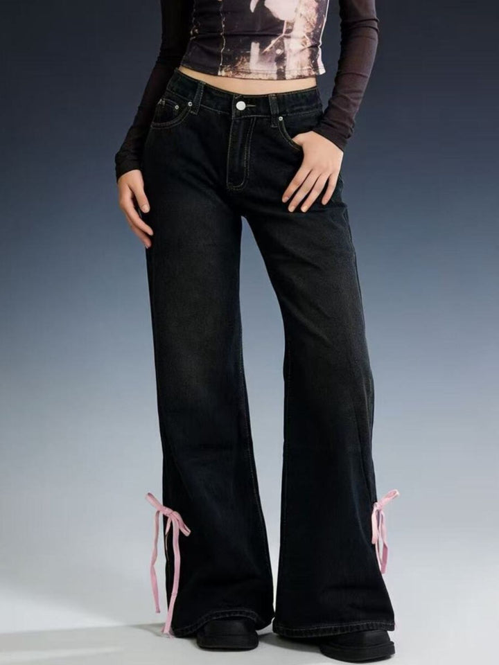 Low-rise flare jeans with ribbon bow leg slits