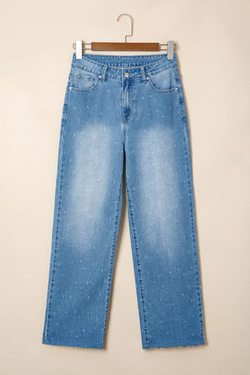 Distressed wide-leg jeans with tummy control and raw hem
