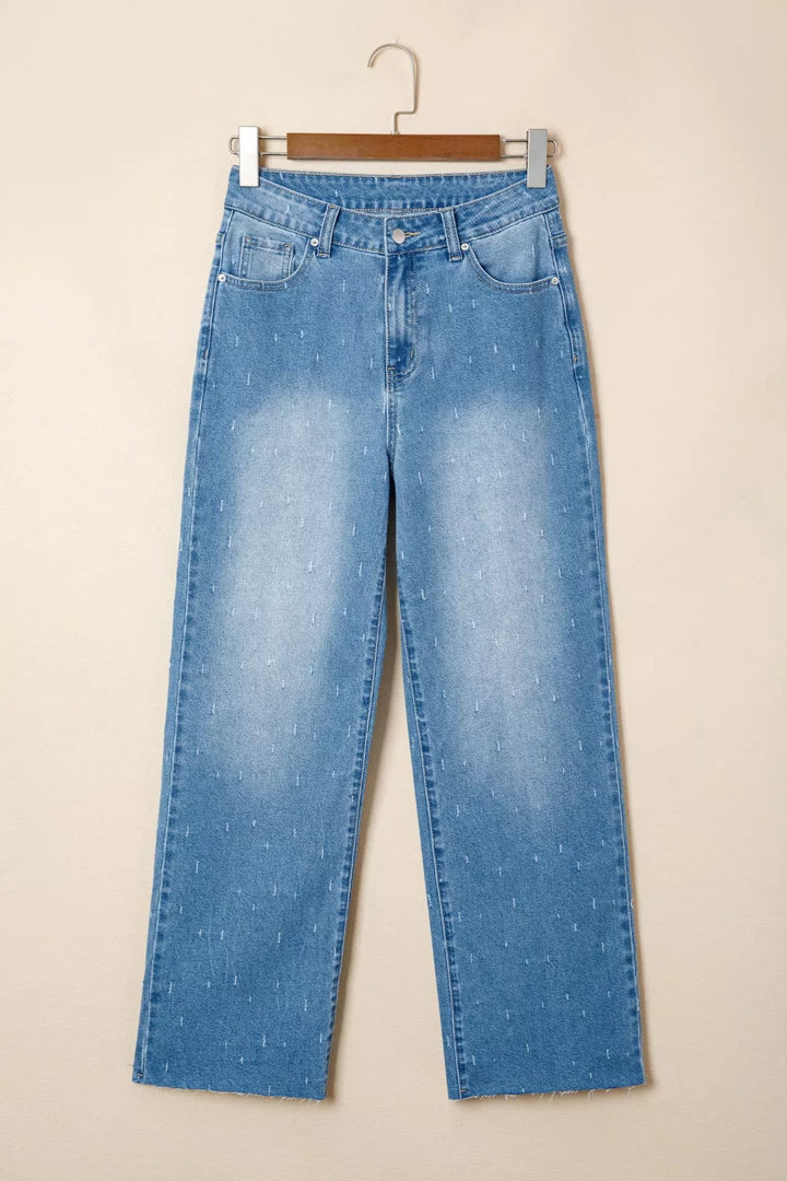 Distressed wide-leg jeans with tummy control and raw hem