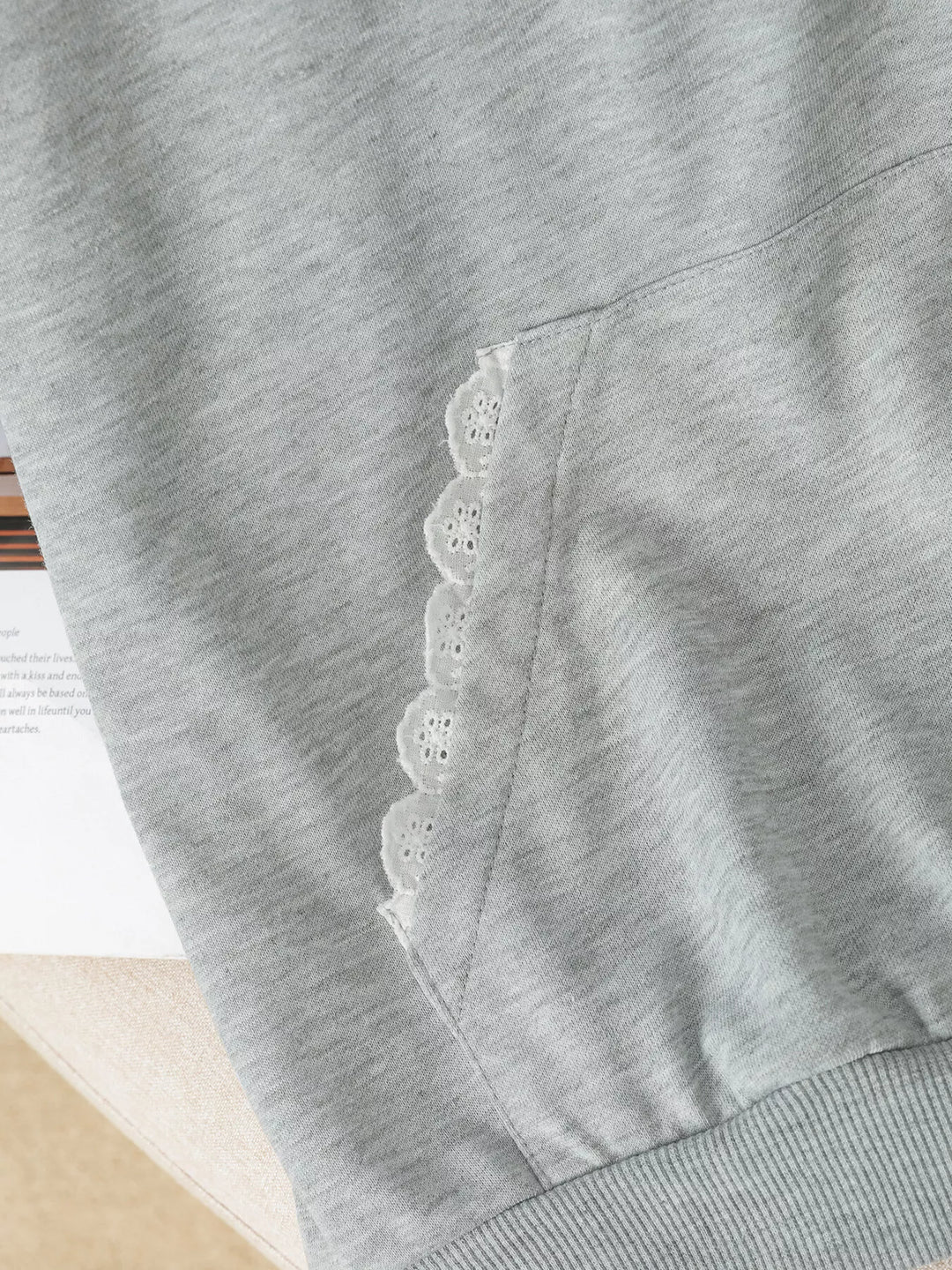 Bow embroidered hoodie with lace trim and front pocket
