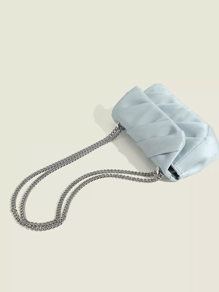 Ruched mini flap crossbody bag with silver chain strap