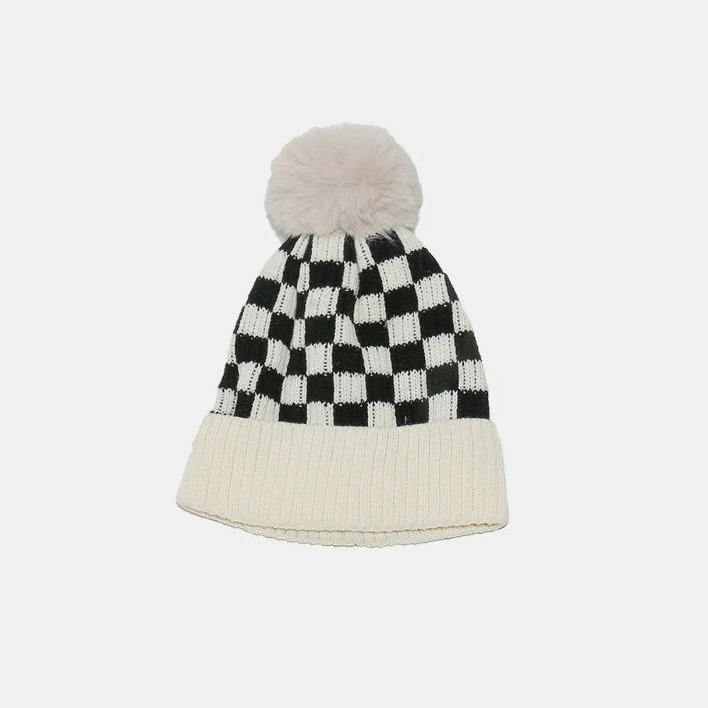 Checkerboard knit beanie with faux fur pompom