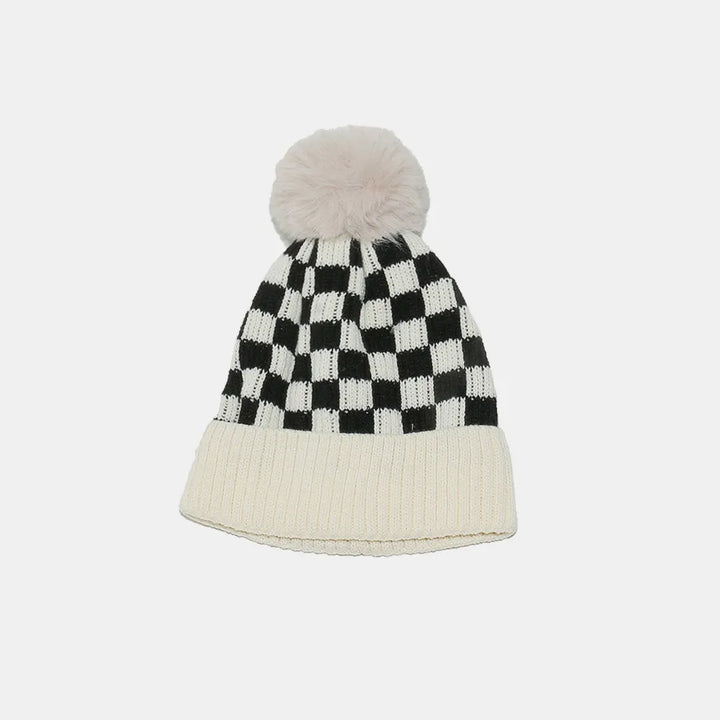 Checkerboard knit beanie with faux fur pompom