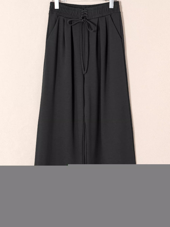 High-rise wide-leg pleated sweatpants with drawstring