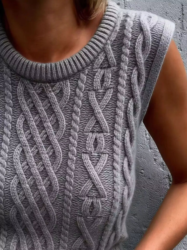 Cable knit sweater vest with ribbed crew neck