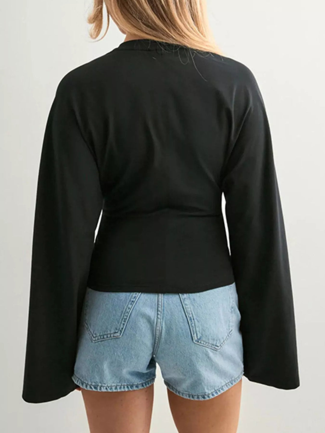 Fitted long sleeve top with flared bell sleeves