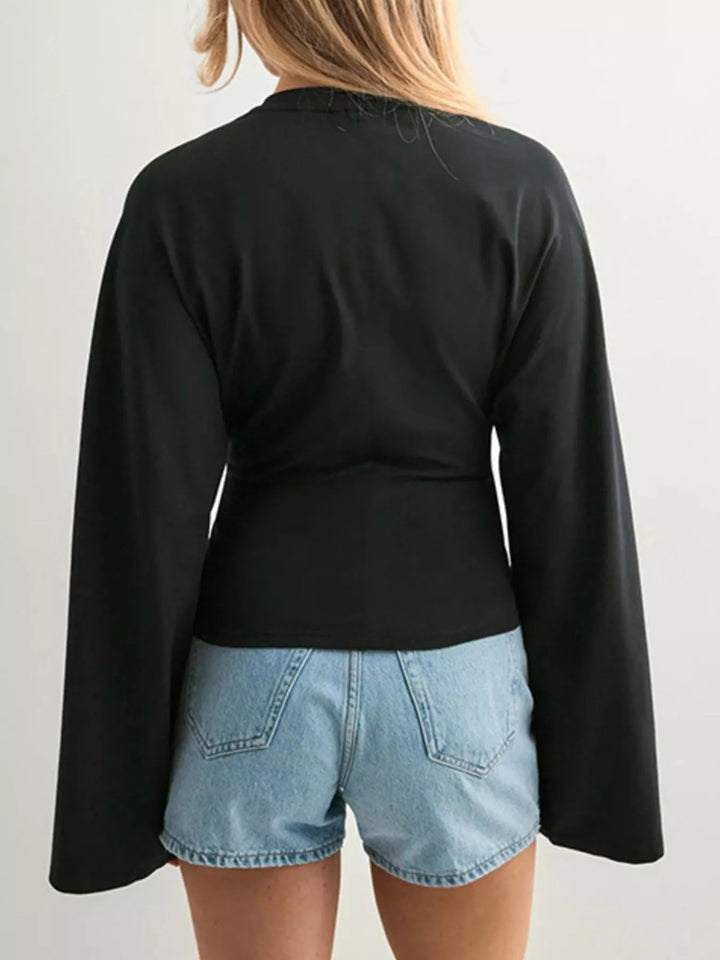 Fitted long sleeve top with flared bell sleeves