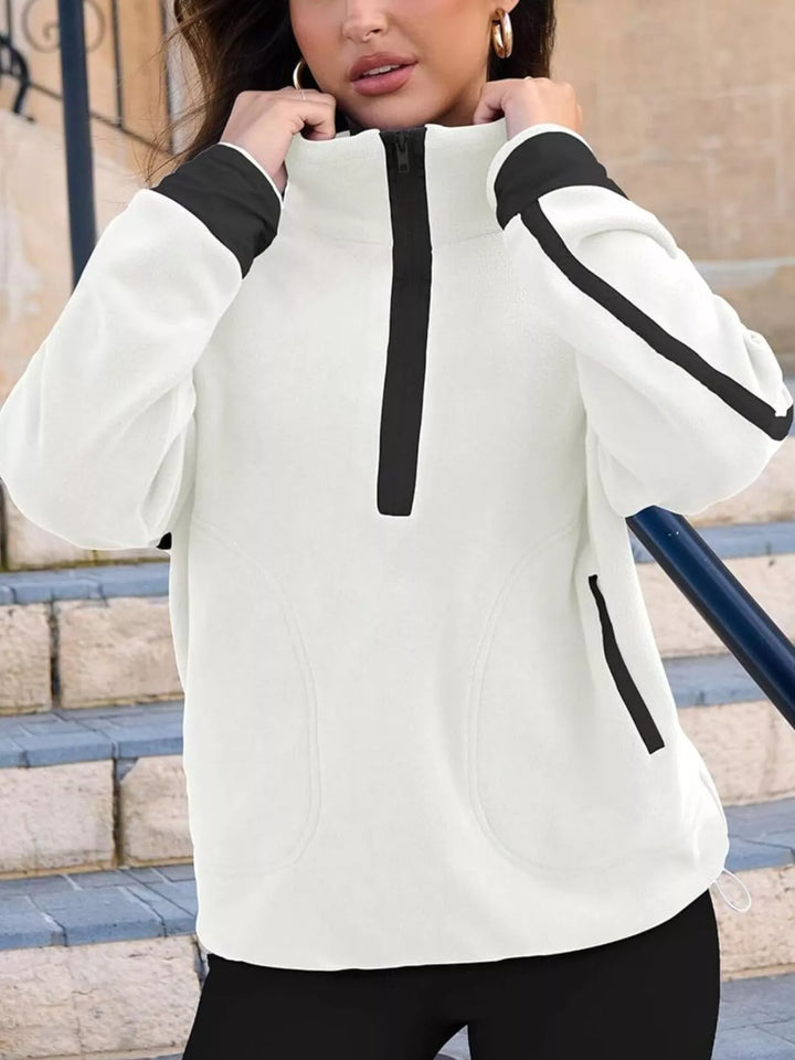 Half-zip fleece pullover with contrast trim and zip pockets