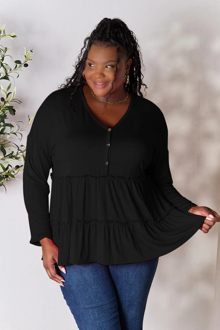 Black Half-button long sleeve blouse with tiered ruffle hem
