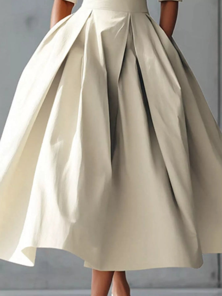 A-line pleated midi dress with side pockets