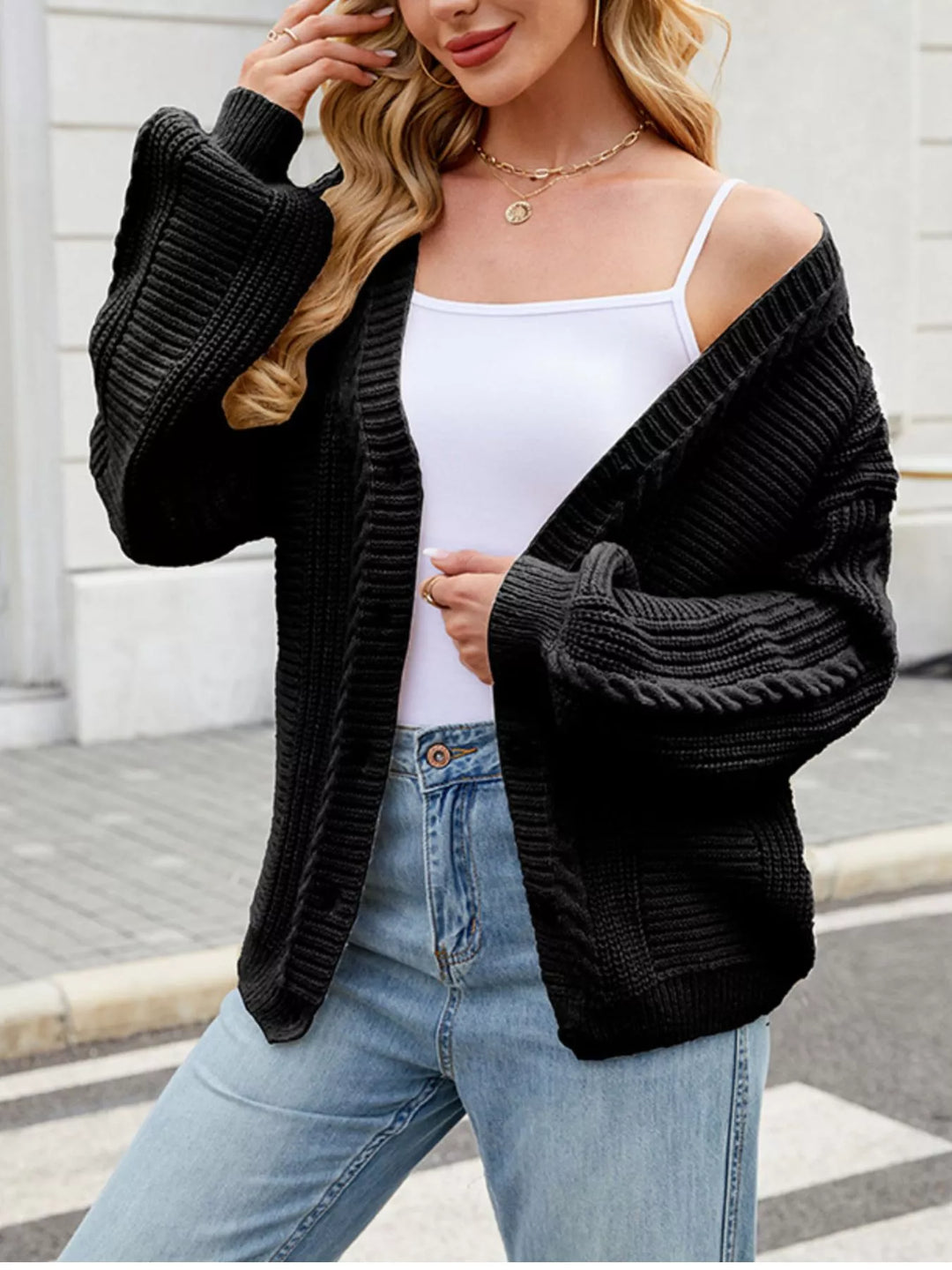 Cable knit button-front cardigan with drop shoulder sleeves