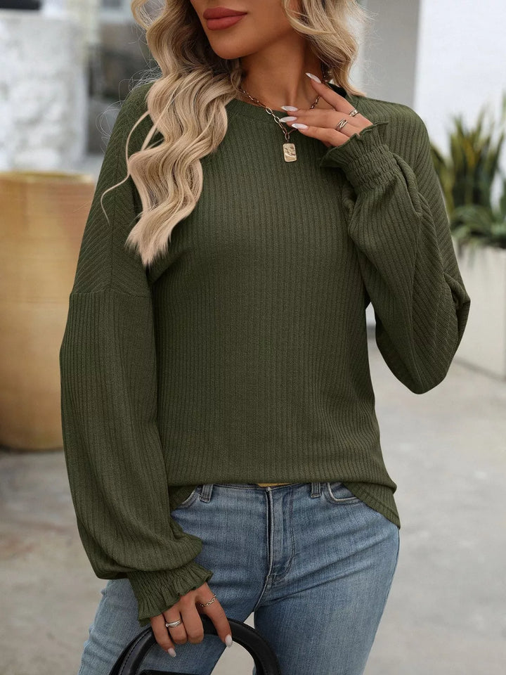 Ribbed knit crew neck top with ruffled smocked cuffs