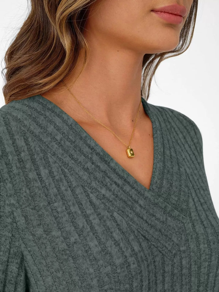 Ribbed knit v-neck top with blouson sleeves