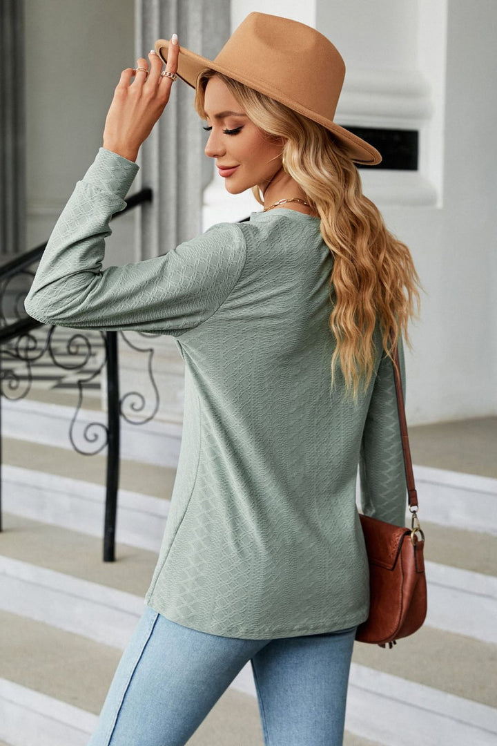 Textured knit long sleeve top with button placket